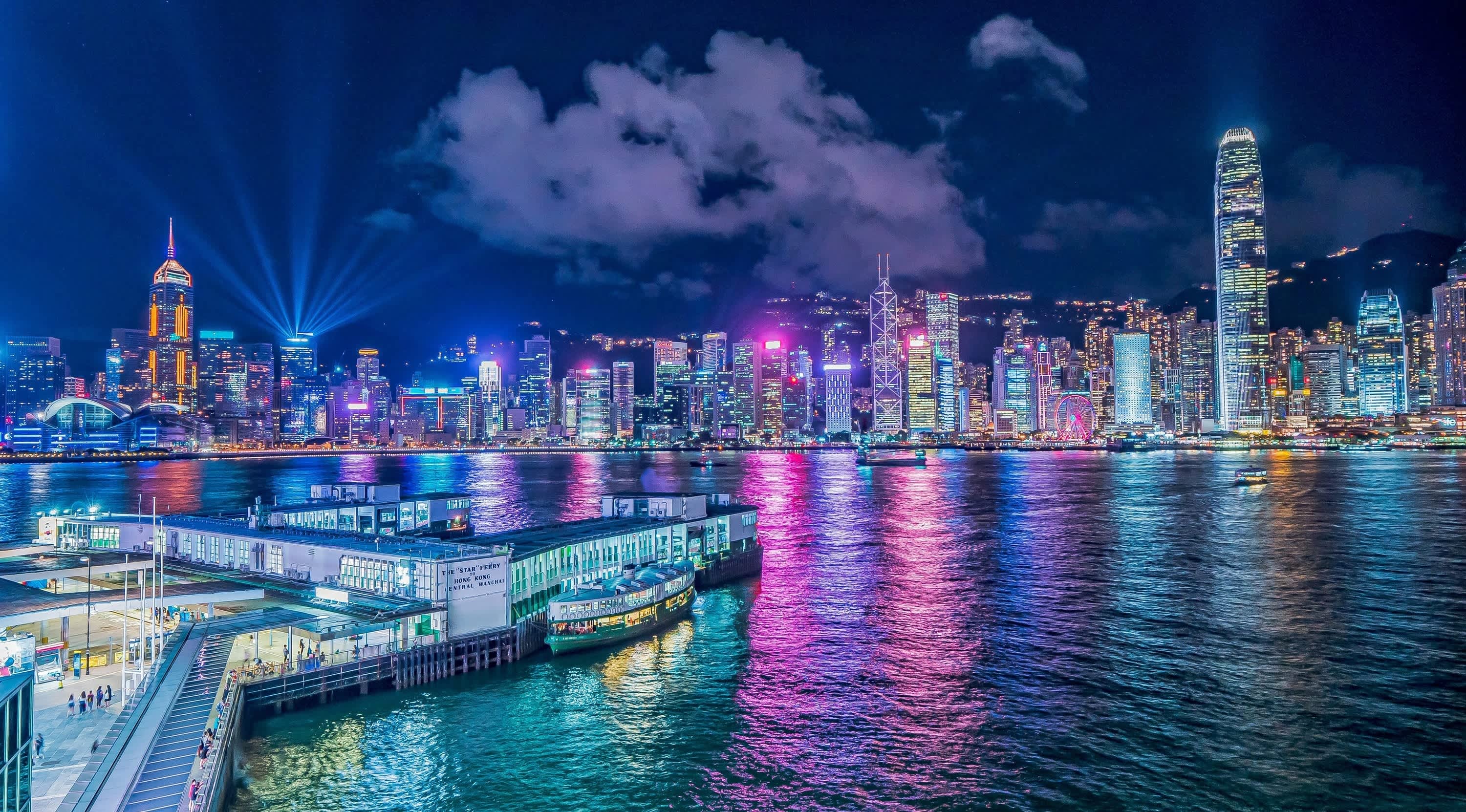 Modern exhibition booth design in Hong Kong at international trade fair with creative branding and lighting setup